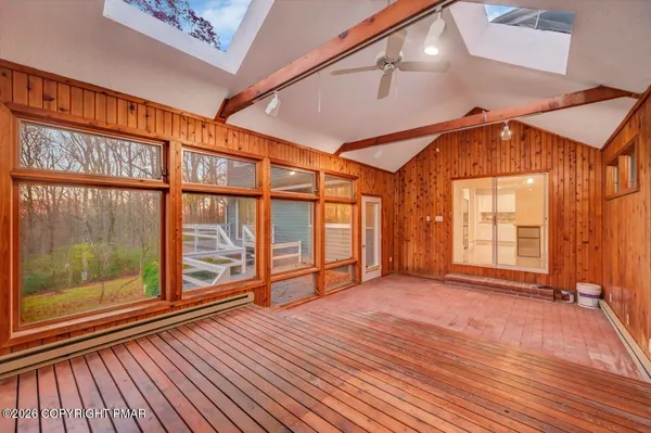 a bathroom with a shower and a glass door