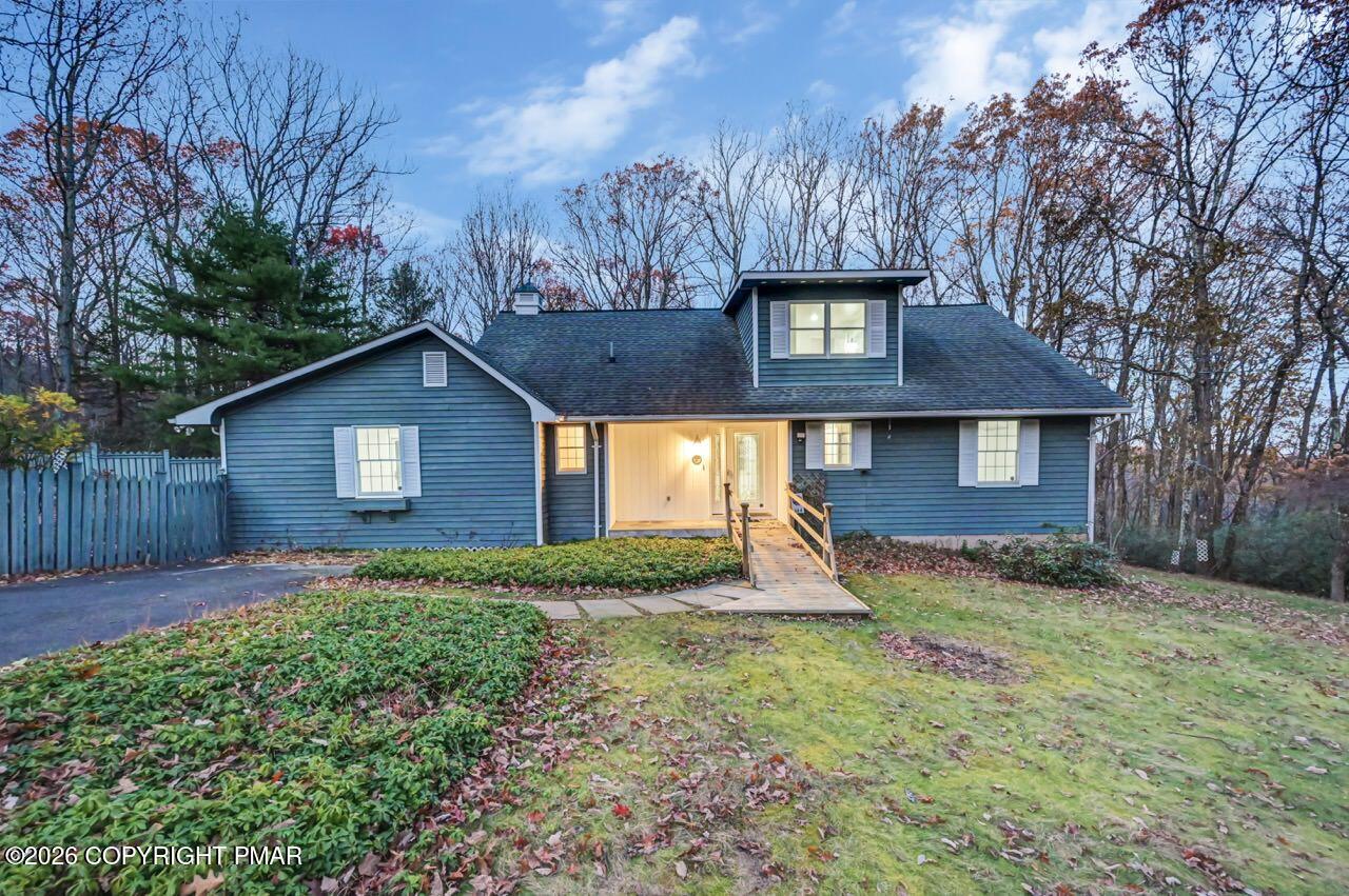 384 Devils Hole Road Cresco, PA 18326 - Photo 51 of 55 a front view of a house with garden