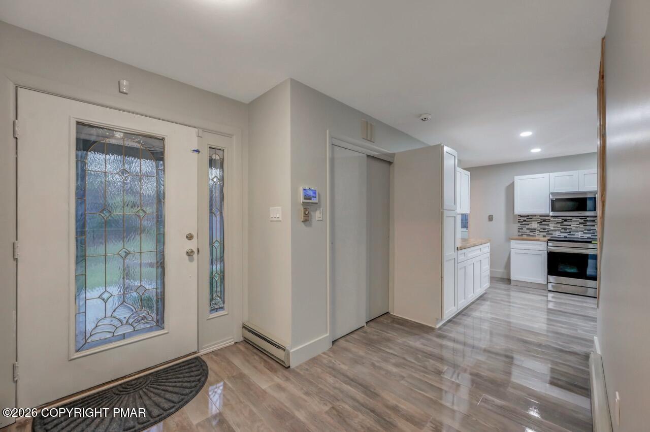 384 Devils Hole Road Cresco, PA 18326 - Photo 6 of 55 a view of a kitchen with refrigerator and microwave