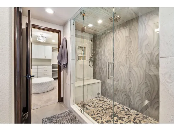 a bathroom with a shower and a sink