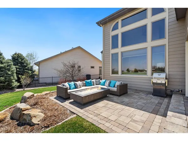 a view of swimming pool outdoor seating and city view