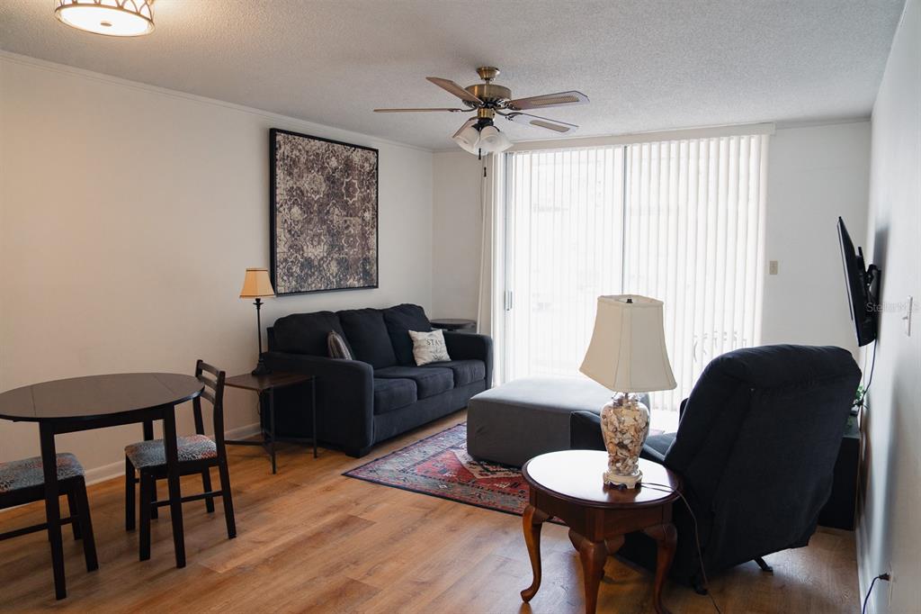 519 Albee Farm Road, Unit 110 Venice, FL 34285 - Photo 26 of 33 a living room with furniture and a large window