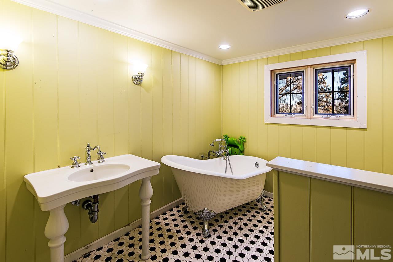 1925 Greenfield Drive Reno, NV 89509 - Photo 12 of 22 a bathroom with a sink and a mirror