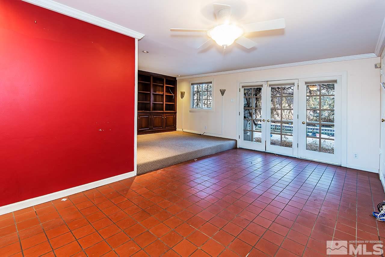 1925 Greenfield Drive Reno, NV 89509 - Photo 9 of 22 an empty room with wooden floor and windows
