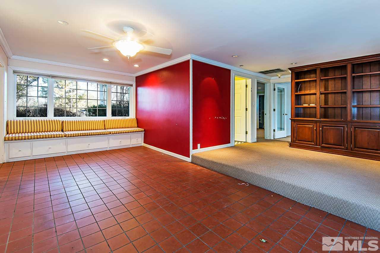 1925 Greenfield Drive Reno, NV 89509 - Photo 10 of 22 a view of an empty room with window and wooden floor