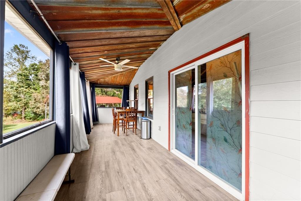 59 Rocket Drive Cleveland, GA 30528 - Photo 21 of 25 a view of a room with wooden floor and furniture