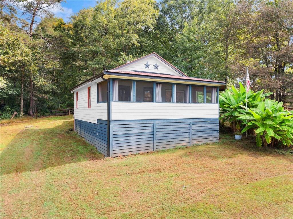 59 Rocket Drive Cleveland, GA 30528 - Photo 4 of 25 a front view of a house with a garden