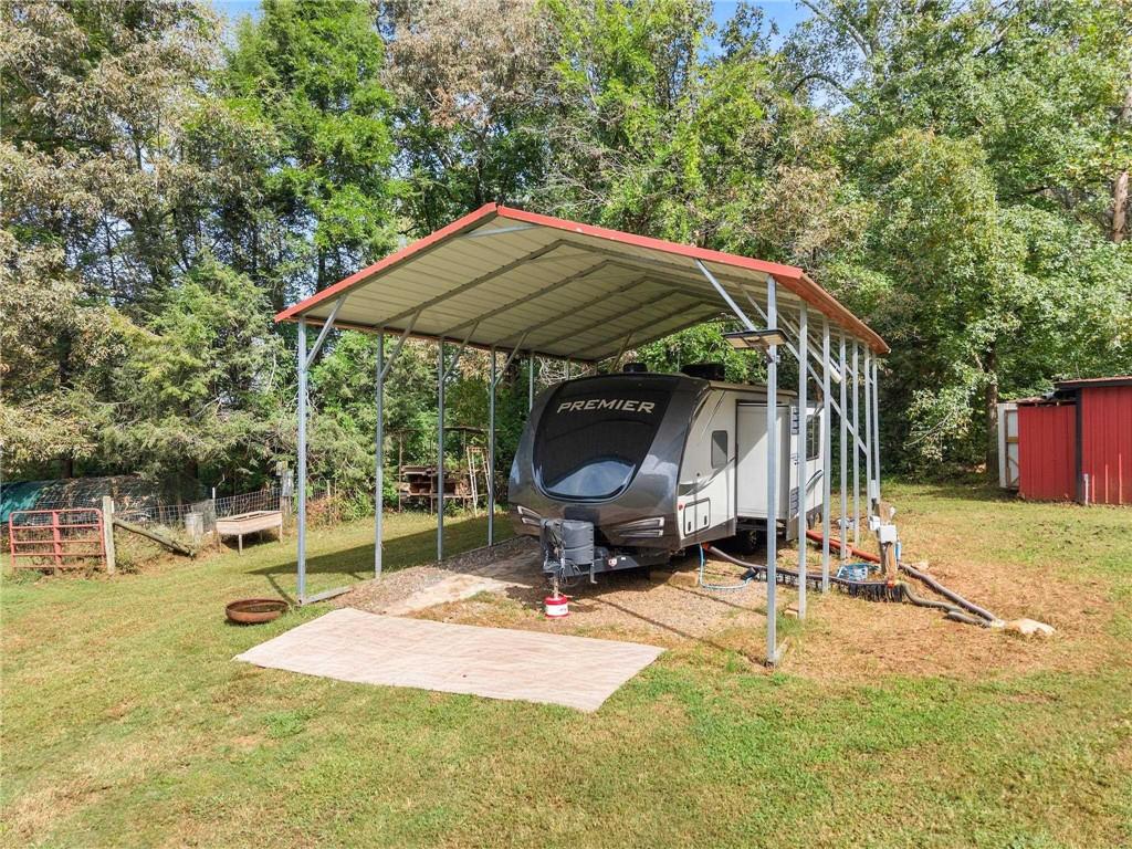 59 Rocket Drive Cleveland, GA 30528 - Photo 5 of 25 a backyard of a house with barbeque oven