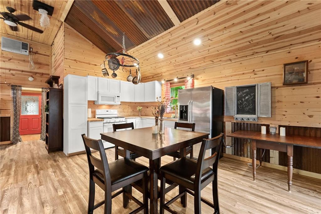 59 Rocket Drive Cleveland, GA 30528 - Photo 7 of 25 a dining area with a table chairs and a kitchen view