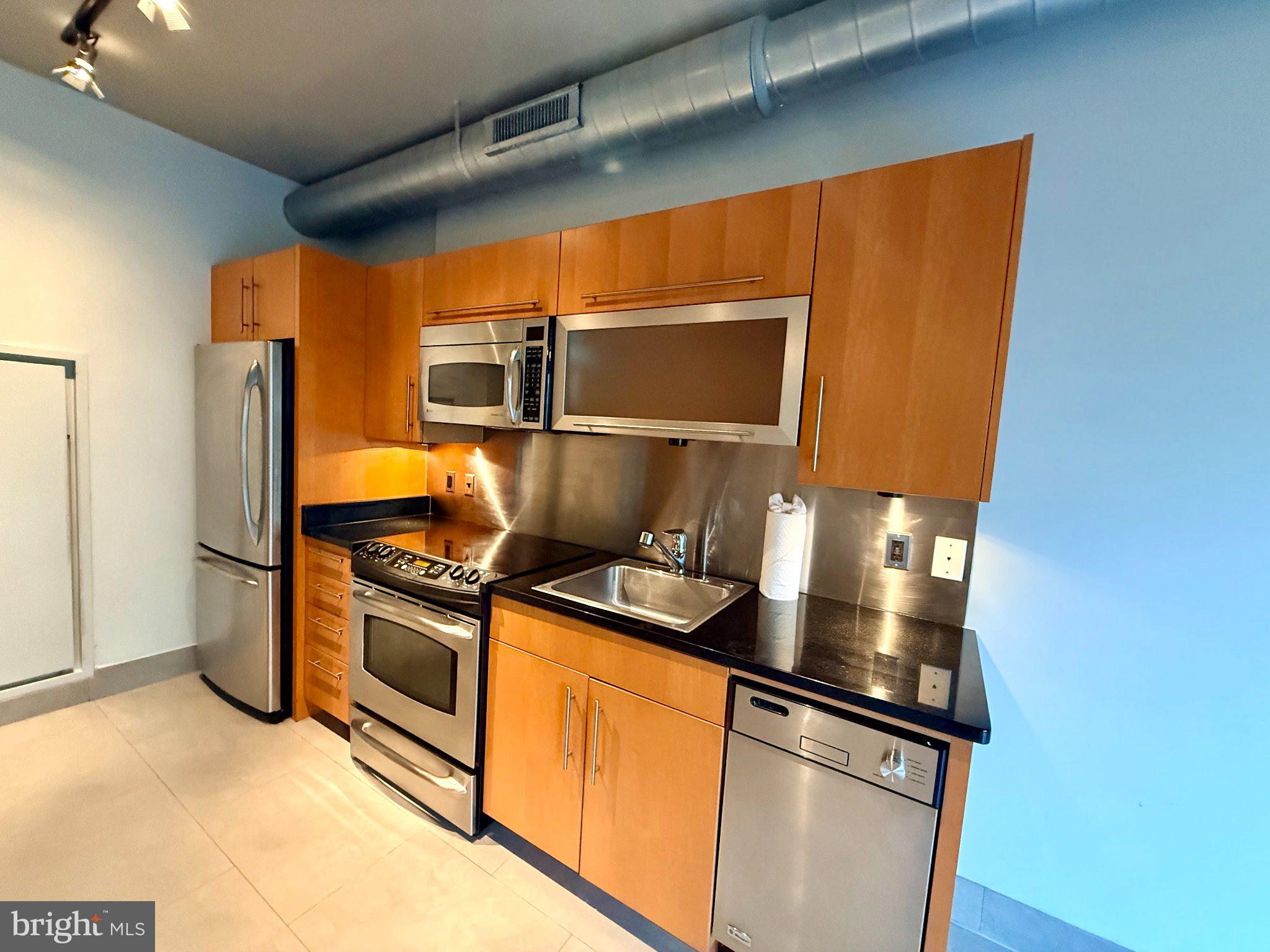 1133 14th Street Northwest, Unit 503 Washington, DC 20005 - Photo 6 of 29 Sleek urban kitchen with modern finishes.
