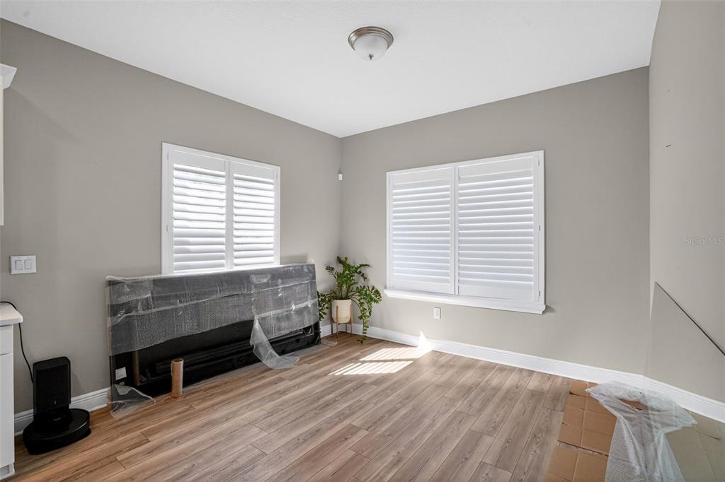 10710 Falling Leaf Court Parrish, FL 34219 - Photo 11 of 50 a living room with furniture and a window
