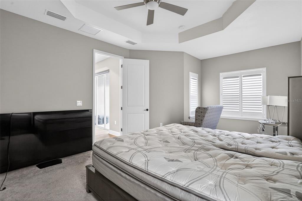 10710 Falling Leaf Court Parrish, FL 34219 - Photo 22 of 50 a bedroom with a bed and window