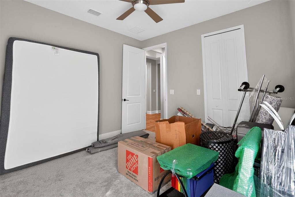 10710 Falling Leaf Court Parrish, FL 34219 - Photo 25 of 50 a living room with furniture and a wooden floor