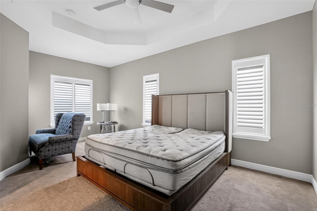 10710 Falling Leaf Court Parrish, FL 34219 - Photo 26 of 50 a bedroom with a bed and wooden floor