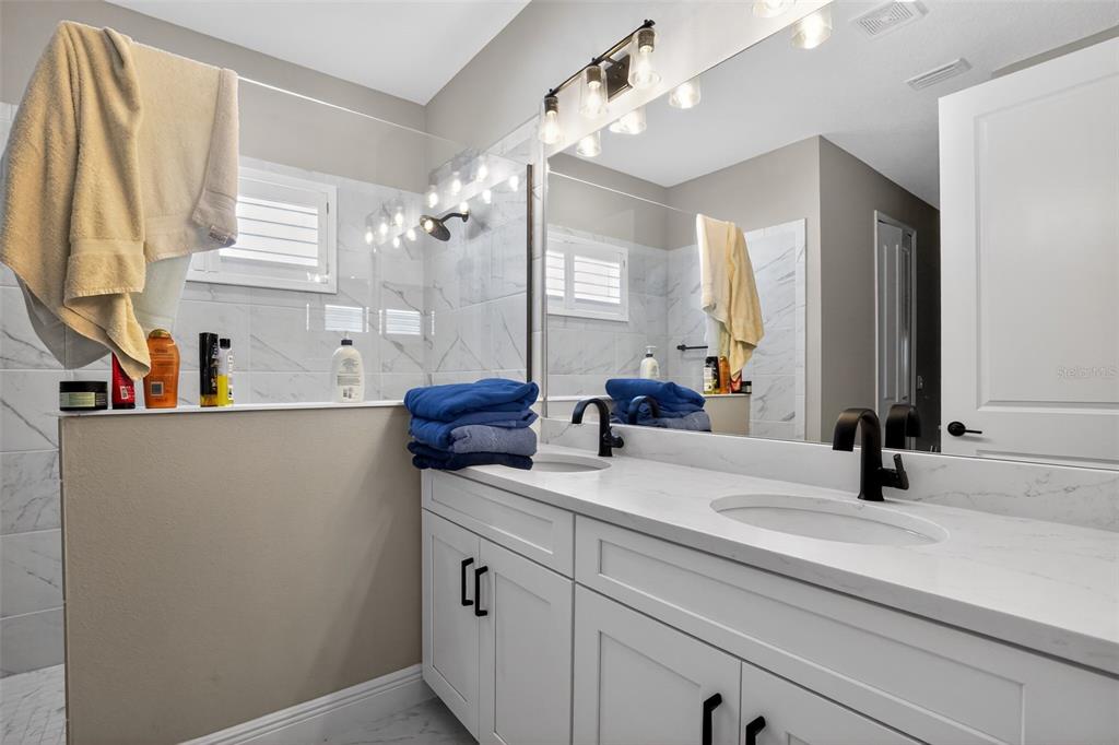 10710 Falling Leaf Court Parrish, FL 34219 - Photo 32 of 50 a view of bathroom with dual sinks