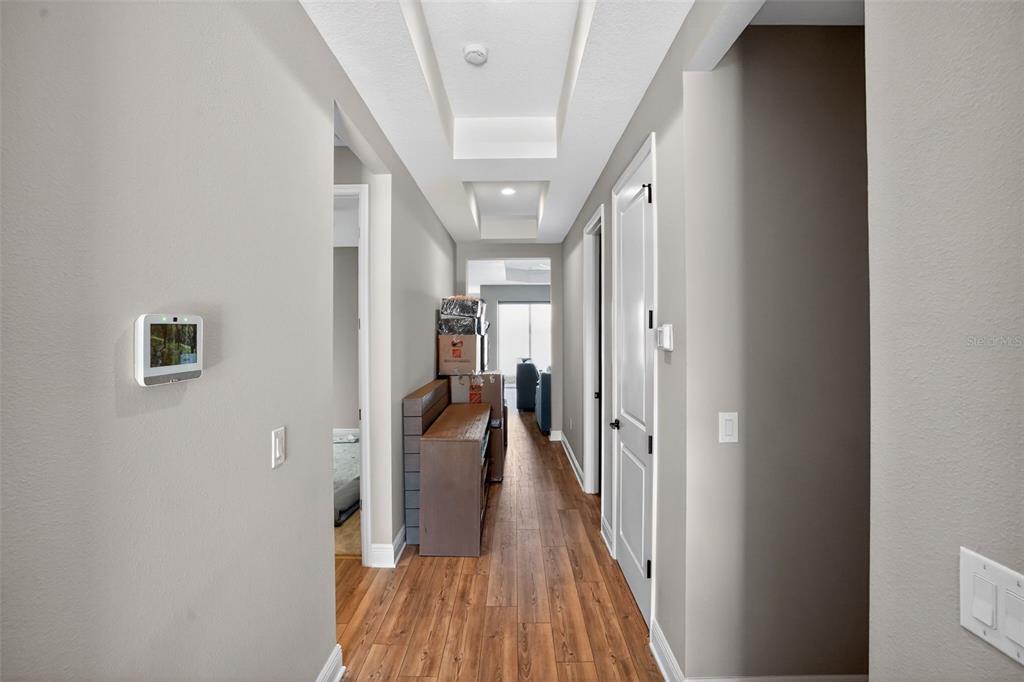 10710 Falling Leaf Court Parrish, FL 34219 - Photo 36 of 50 a view of a hallway with wooden floor and staircase