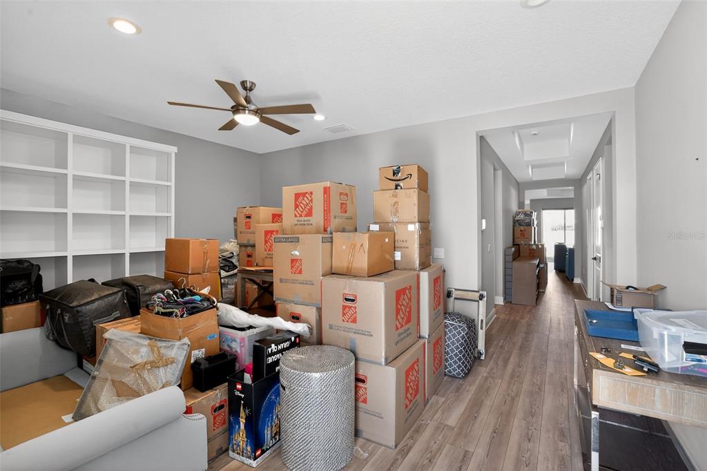 10710 Falling Leaf Court Parrish, FL 34219 - Photo 48 of 50 a view of a livingroom with workspace and a couch