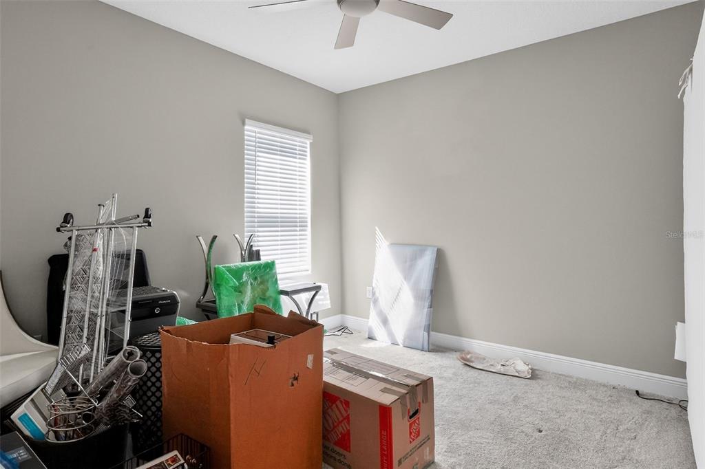 10710 Falling Leaf Court Parrish, FL 34219 - Photo 50 of 50 a living room with furniture and a window