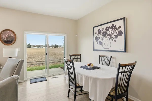 a view of a dining room with furniture window and outside view