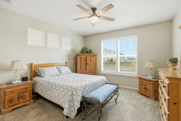 a bedroom with a bed and a table in it