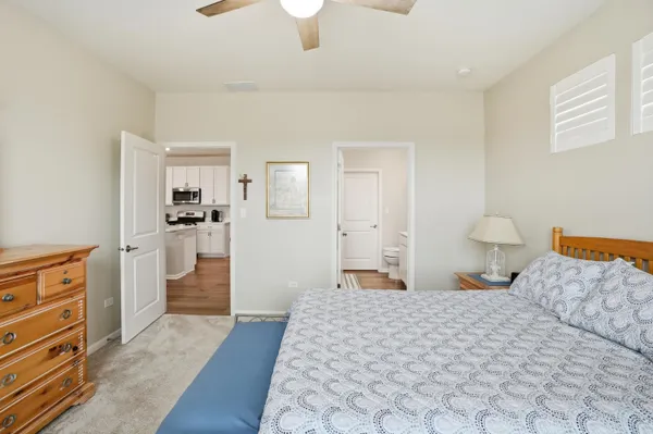 a bedroom with a bed and cabinets