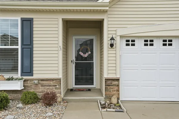 a front view of a house with a garage