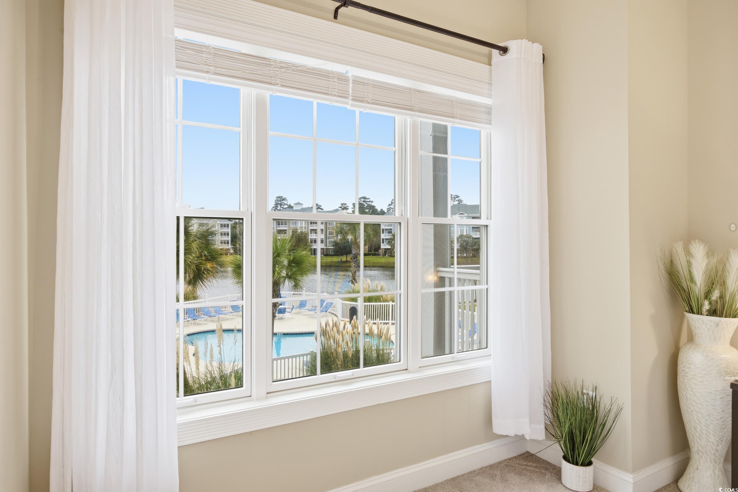 4833 Luster Leaf Circle, Unit 201 Myrtle Beach, SC 29577 - Photo 28 of 39 Entryway with a water view and plenty of natural light