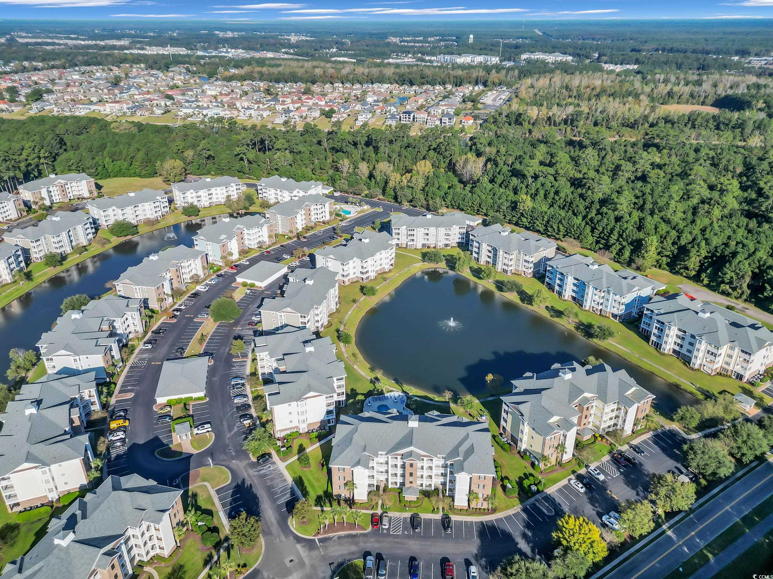 4833 Luster Leaf Circle, Unit 201 Myrtle Beach, SC 29577 - Photo 37 of 39 Aerial view of property's location featuring a nearby body of water and apartment complex / building