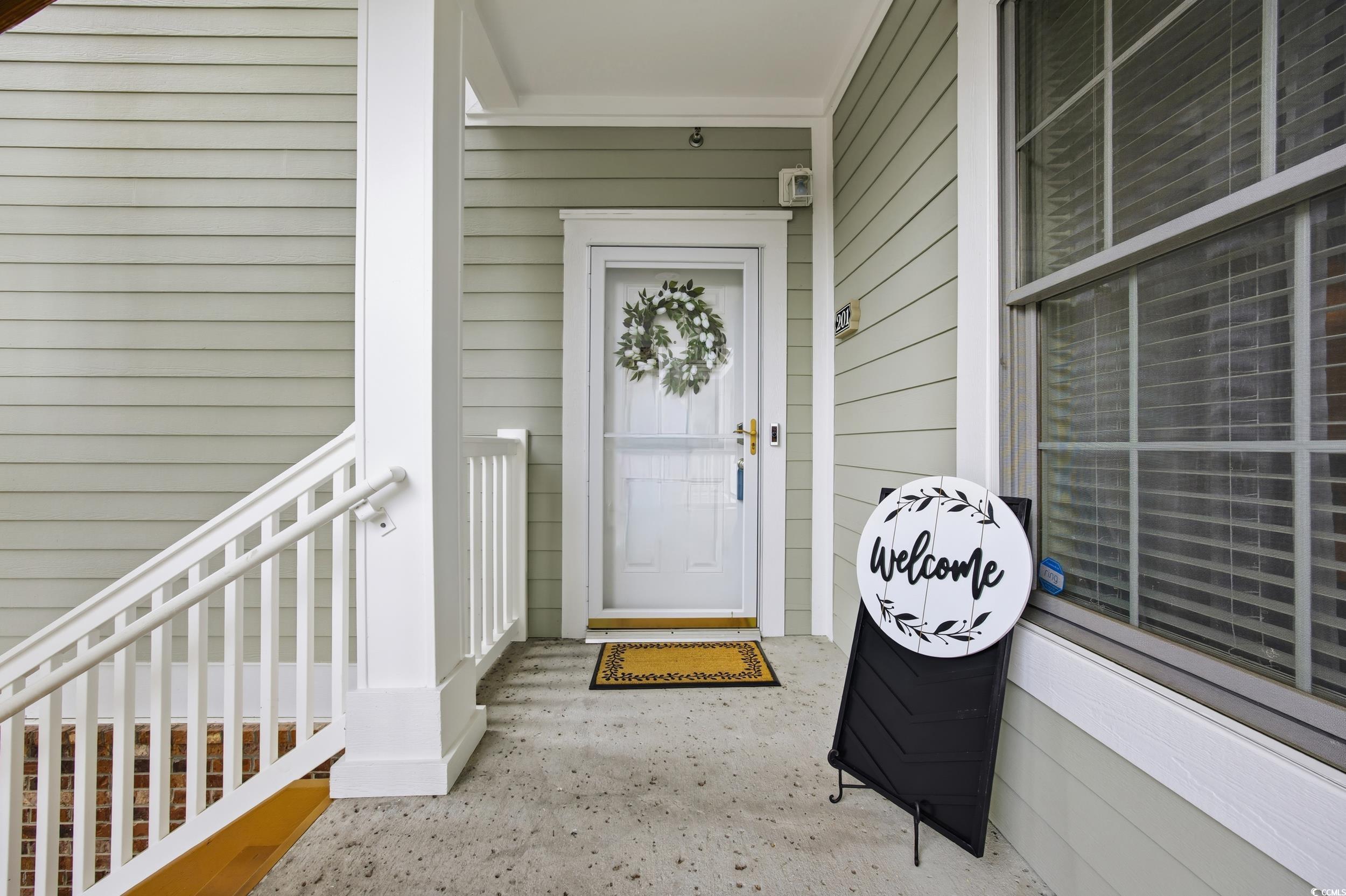 4833 Luster Leaf Circle, Unit 201 Myrtle Beach, SC 29577 - Photo 5 of 39 Property entrance with covered porch