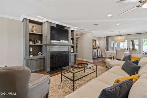 a living room with furniture a chandelier and a chandelier