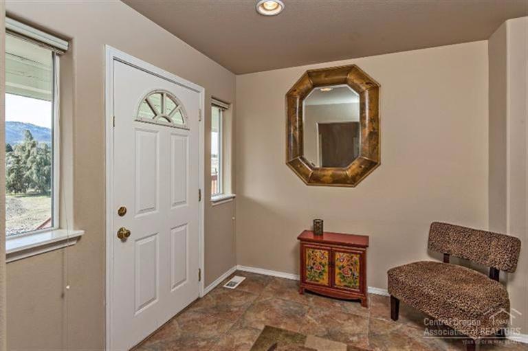 9552 Southwest Old West Road Powell Butte, OR 97753 - Photo 2 of 13 Tile floors in this bright, sunny entry.