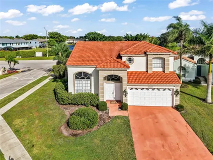 an aerial view of a house with a yard and a garden