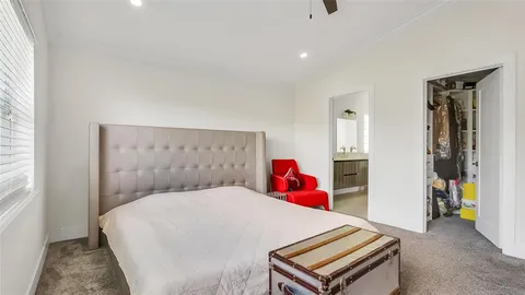 a bed room with a bed and a desk