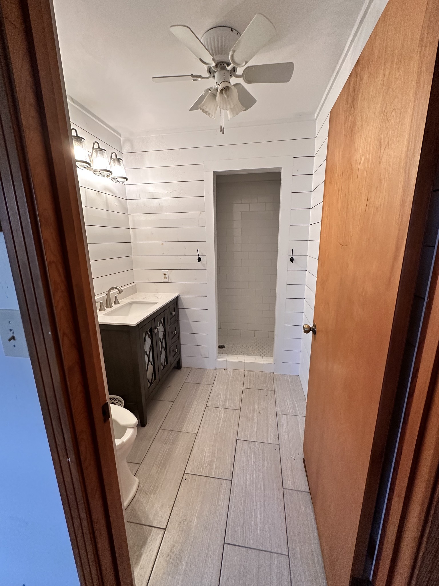 2180 South Williams Road Greenbrier, TN 37073 - Photo 14 of 19 a bathroom with a granite countertop sink a toilet and a shower