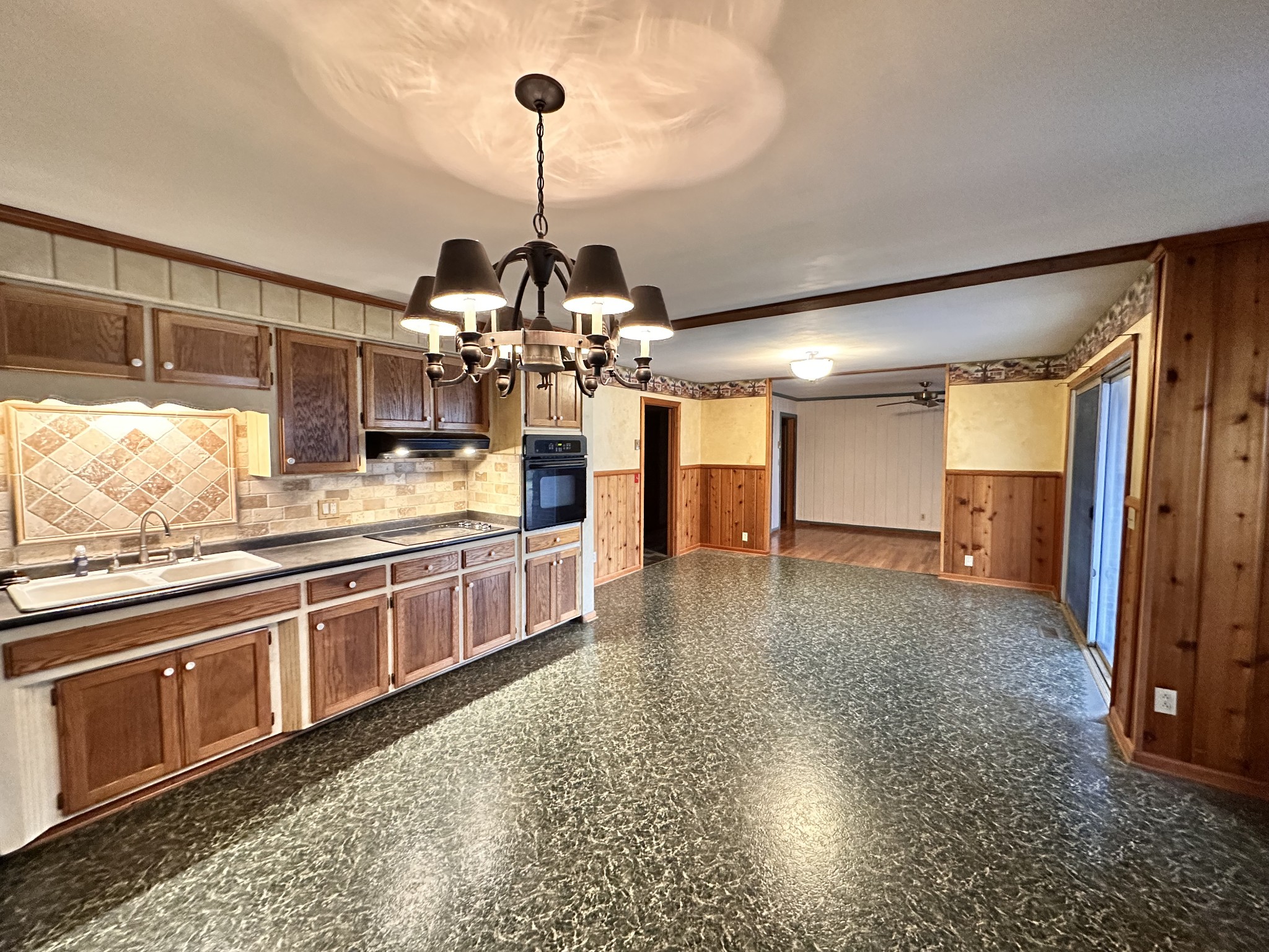 2180 South Williams Road Greenbrier, TN 37073 - Photo 6 of 19 a open kitchen with stainless steel appliances granite countertop a sink and refrigerator