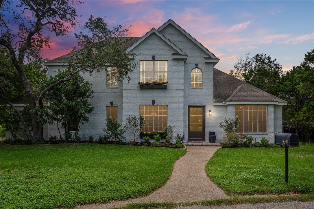front view of a house with a yard