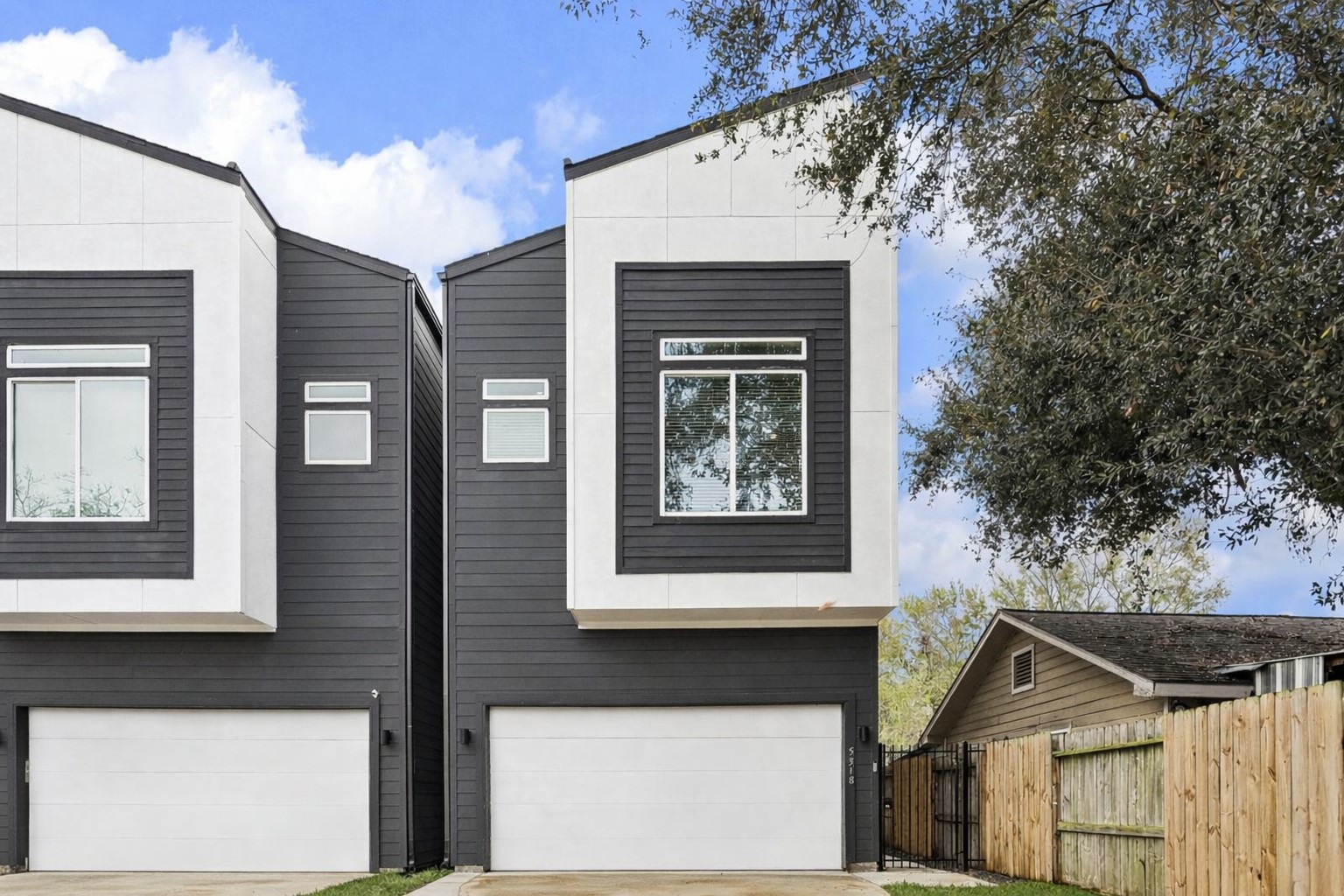 a front view of a house with large windows