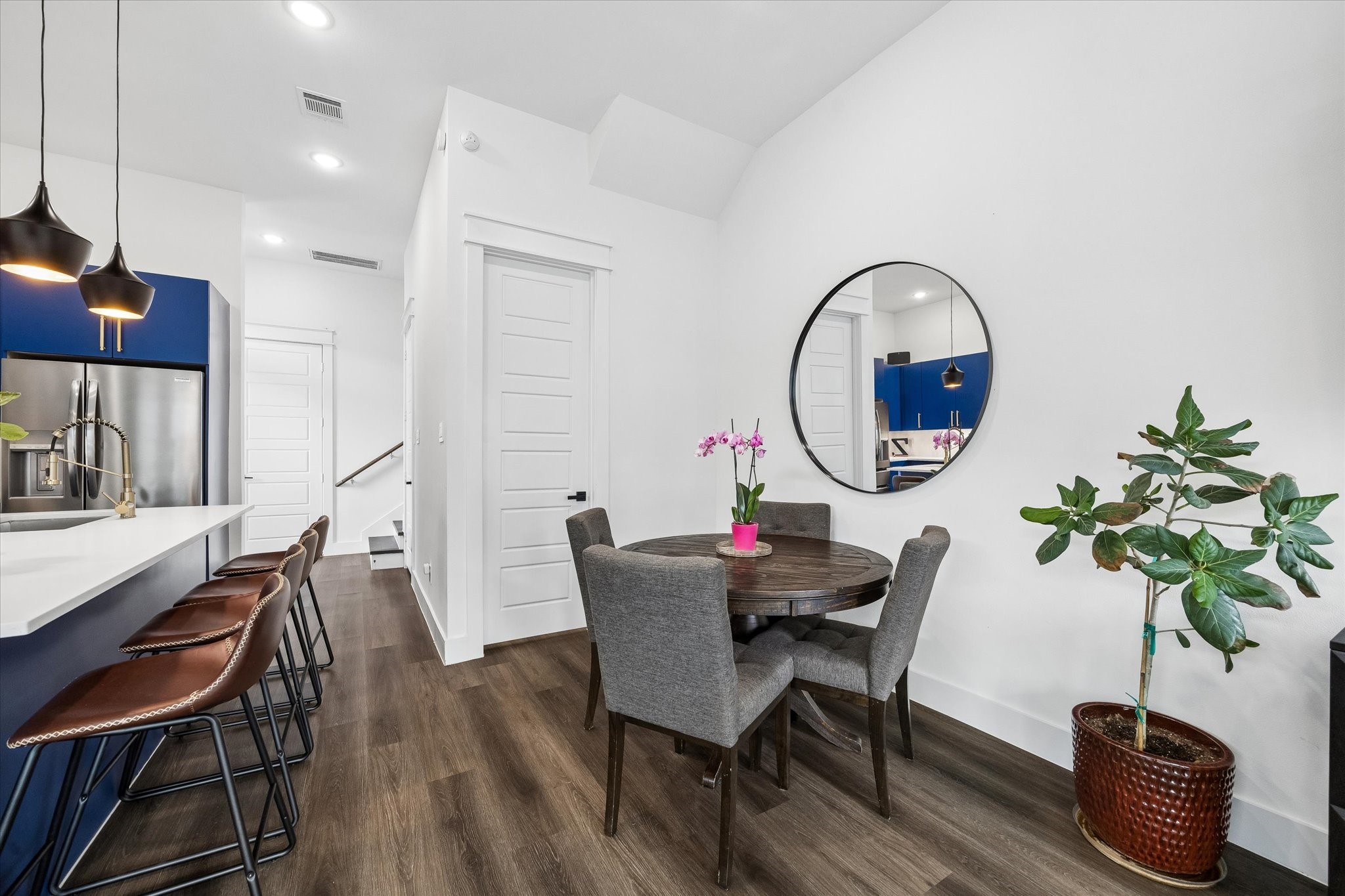 5318 Wunder Lane Houston, TX 77091 - Photo 12 of 25 a living room with furniture a potted plant and a chandelier