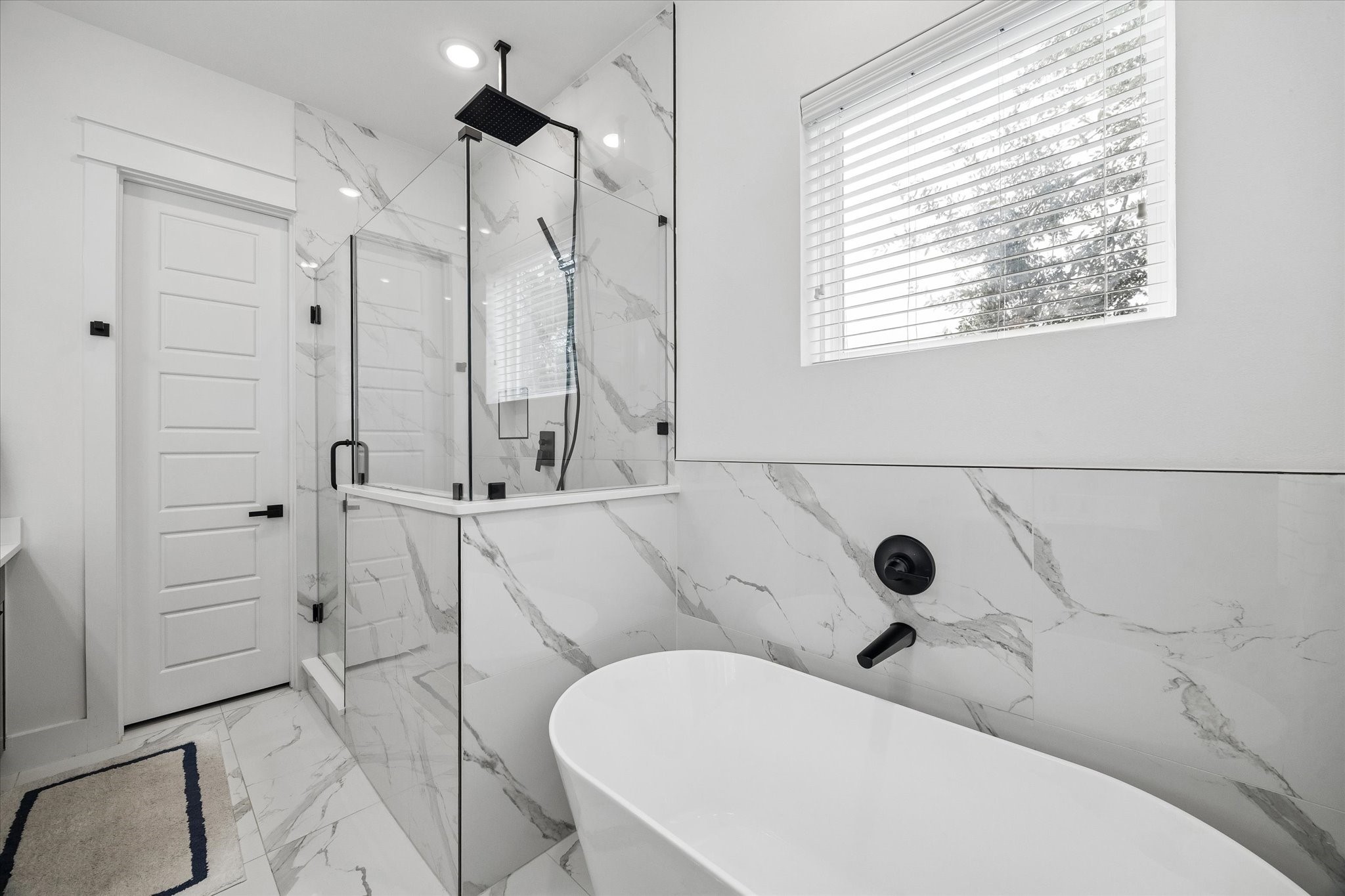 5318 Wunder Lane Houston, TX 77091 - Photo 17 of 25 a bathroom with a toilet a sink and shower