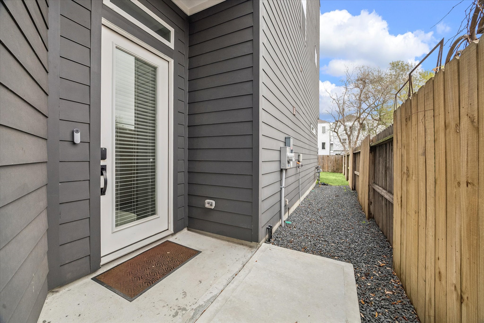 5318 Wunder Lane Houston, TX 77091 - Photo 2 of 25 a view of a pathway of a house with a door and wooden walls