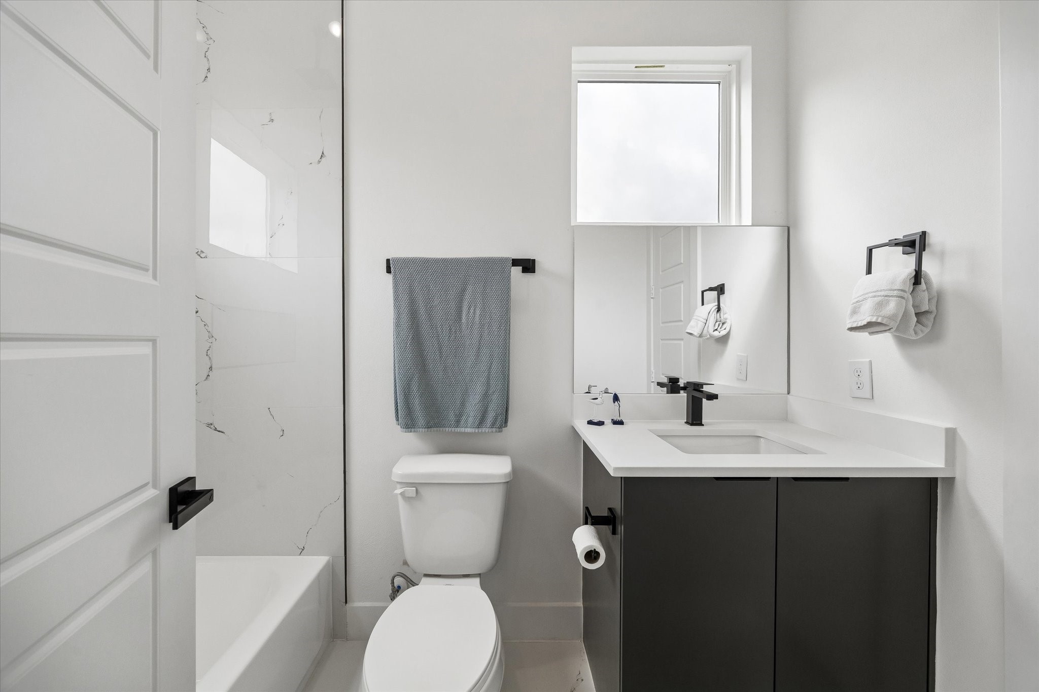 5318 Wunder Lane Houston, TX 77091 - Photo 21 of 25 a bathroom with a toilet sink and mirror