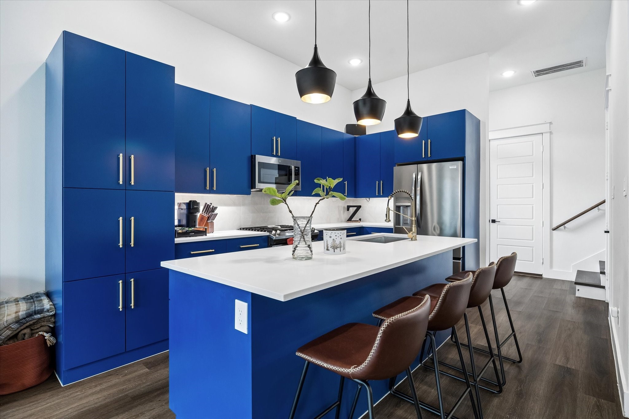 5318 Wunder Lane Houston, TX 77091 - Photo 9 of 25 a white kitchen with a dining table chairs and refrigerator