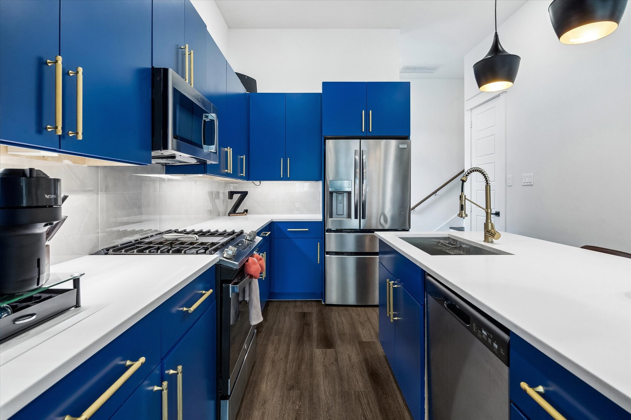 5318 Wunder Lane Houston, TX 77091 - Photo 10 of 25 a kitchen with kitchen island a sink stove and refrigerator