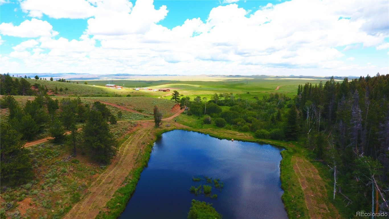 376 Deer Crossing Road Tie Siding, WY 82084 - Photo 20 of 28 a view of an outdoor space and a lake view