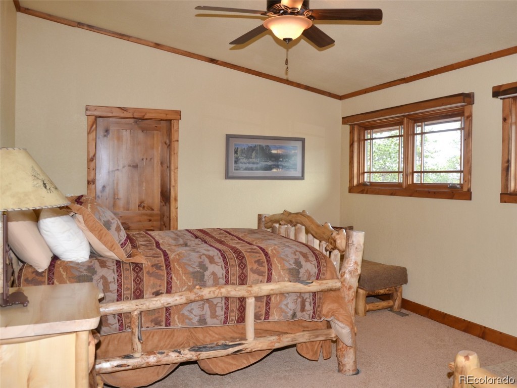 376 Deer Crossing Road Tie Siding, WY 82084 - Photo 8 of 28 a bed sitting in a bedroom next to a window