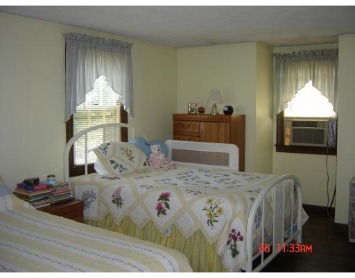 15 Upland Street Springfield, MA 01104 - Photo 8 of 17 a bedroom with a bed and a window