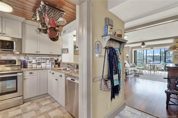 a kitchen with a stove cabinets and a stove