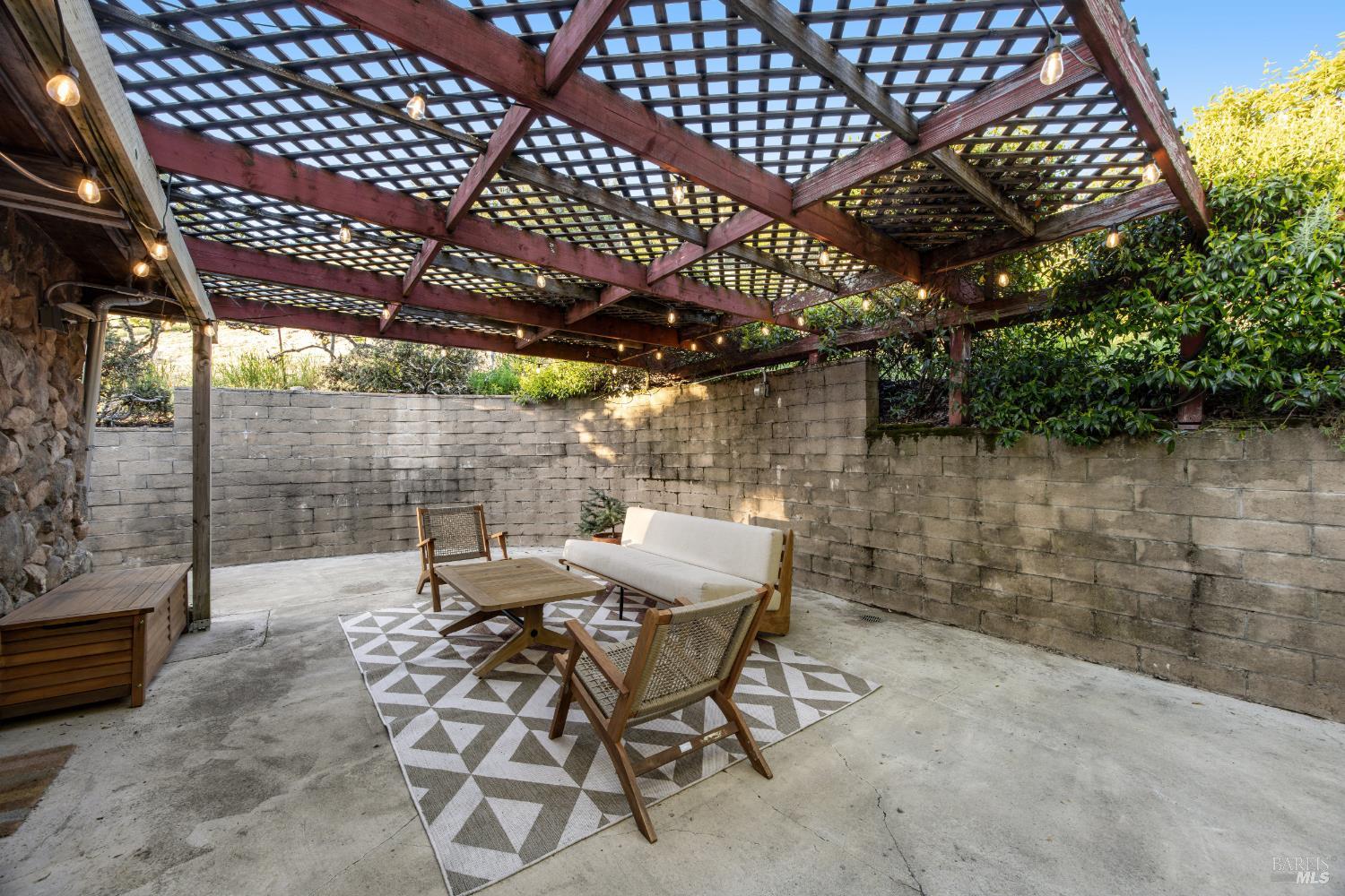 6960 Round Oak Road Penngrove, CA 94951 - Photo 46 of 58 a view of a patio with table and chairs and potted plants