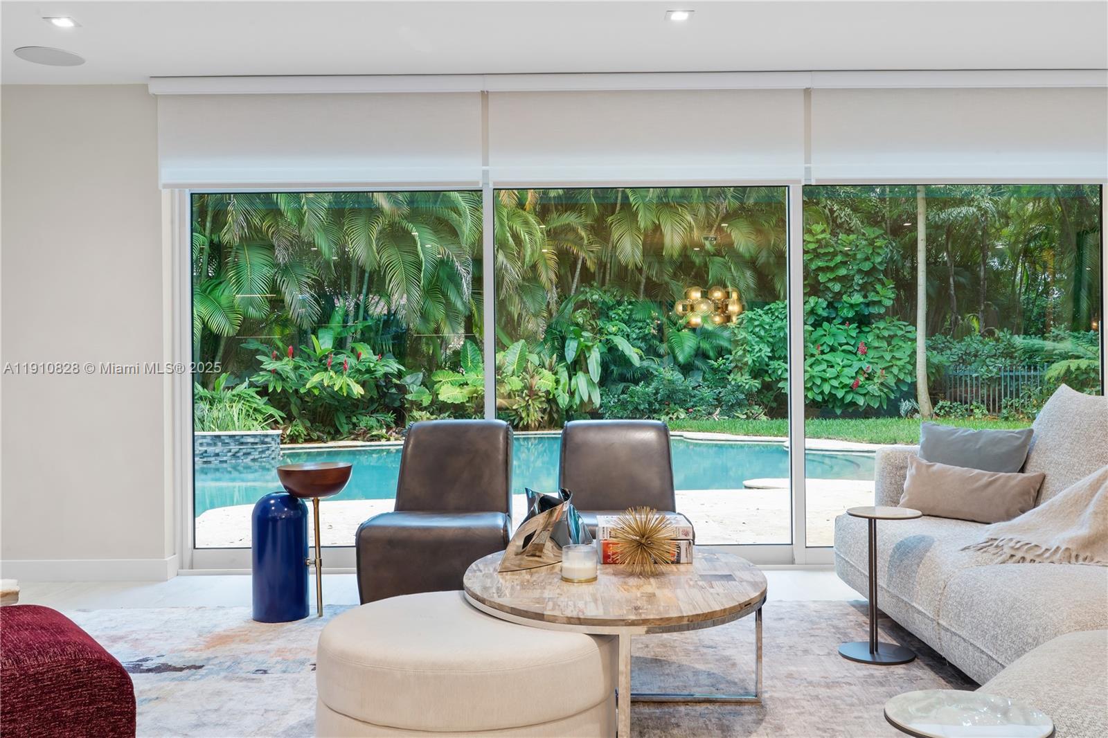 1075 Northeast 99th Street Miami Shores, FL 33138 - Photo 11 of 63 a outdoor living space with furniture and a garden