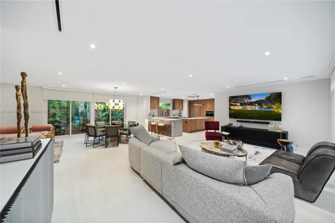 a living room with furniture fireplace and a table